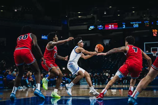 RJ Smith setting up a 3-point shot.