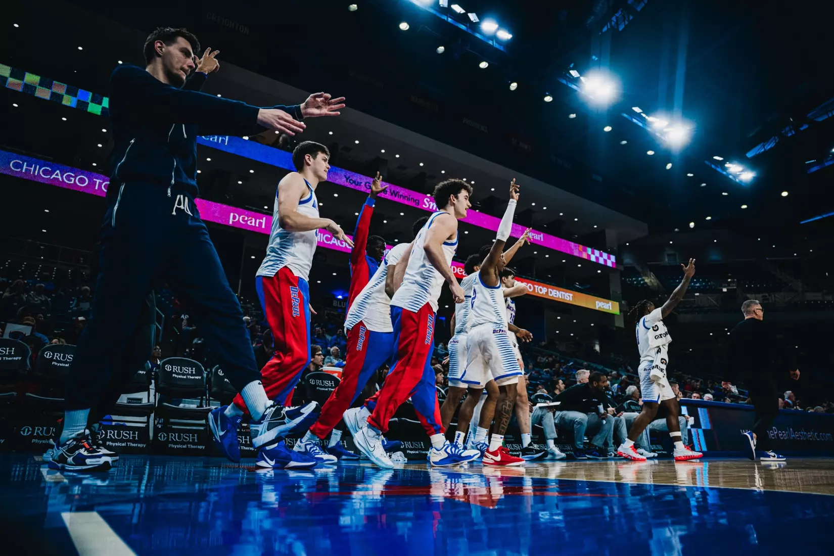 Celebrations from the bench after a 3-point play by Kaleb Banks