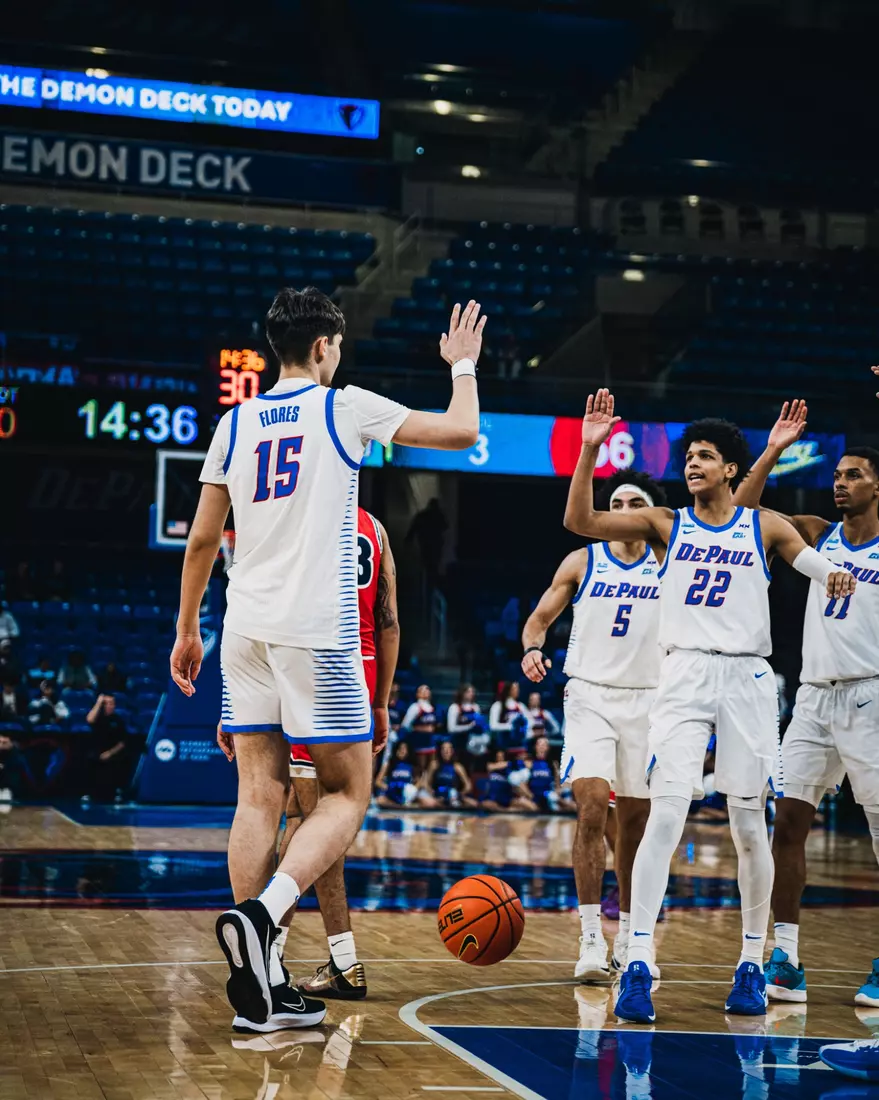 Kruz McClure and Fabian Flores celebrate after drawing a foul.