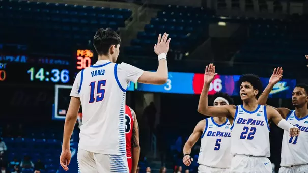 Kruz McClure and Fabian Flores celebrate after drawing a foul.