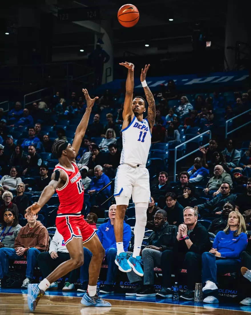 CJ Gunn taking a 3-point jumper.