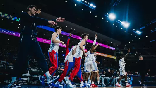 Celebrations from the bench after a 3-point play by Kaleb Banks