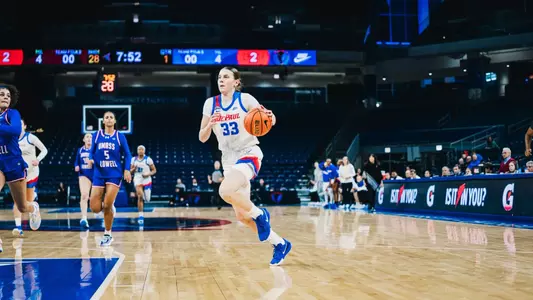 Kate Novik dribbles to the paint and puts pressure on the defense.