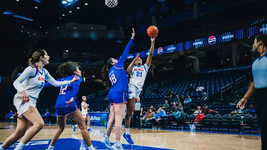 Natiah Nelson shoots the layup over the UMass defender.