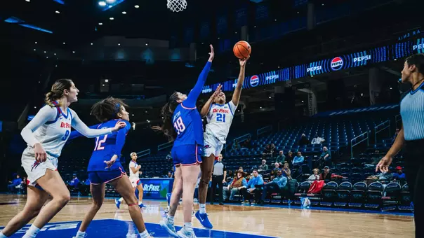 Natiah Nelson shoots the layup over the UMass defender.