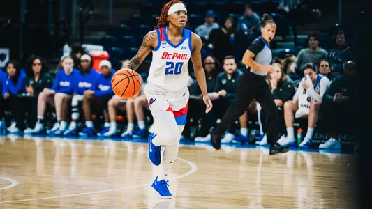 Shakara McCline dribbles the ball