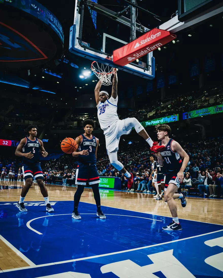 Forward NJ Benson finishes the lob for two.