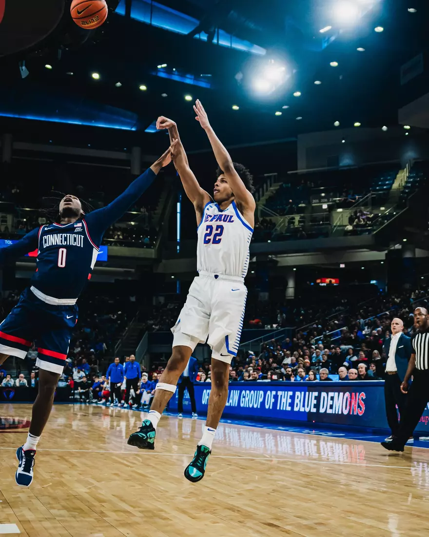 Freshman Kruz McClure fades away from midrange against UConn.