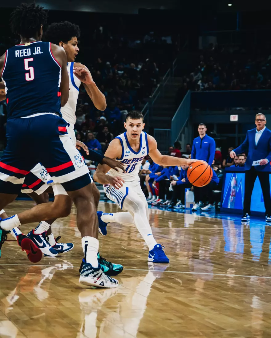 Guard Ilija Milijaševic looks for a pass to a fellow Blue Demon.