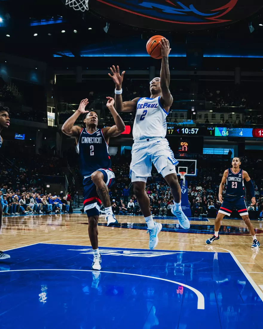 Guard Layden Blocker attempts a layup against UConn.
