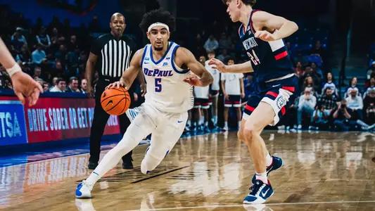 RJ Smith looks to drive in and get a look at the rim.