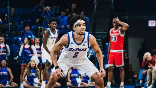 RJ Smith playing defense.