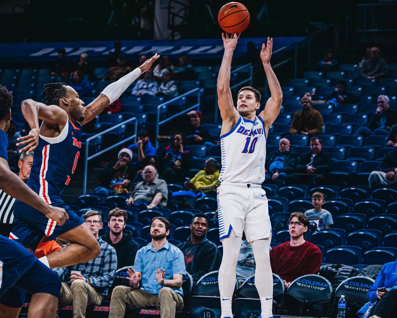 Ilija Milijaševic attempts a three pointer.