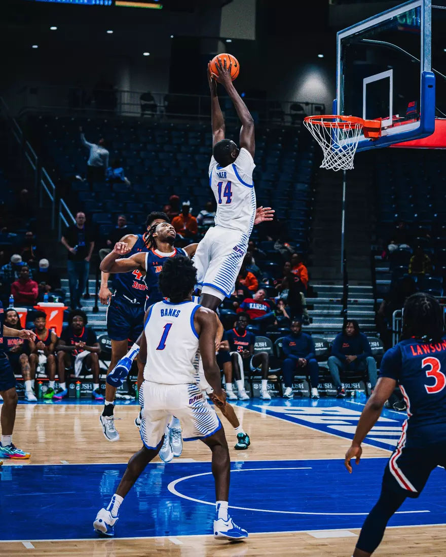 Khaman Maker attempts a dunk.