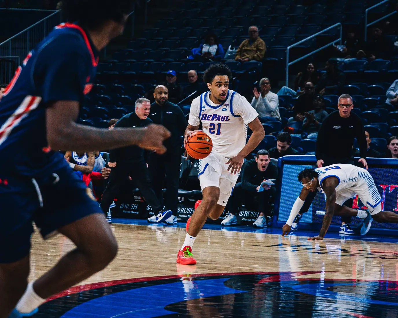 Théo Pierre-Justin pushes the ball up the court.