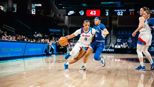 Taylor Johnson-Matthews dribbles to the basket