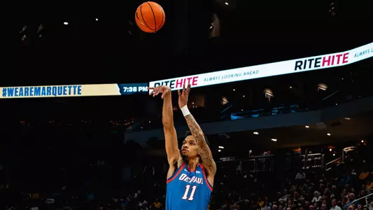 CJ Gunn shoot a three-point shot