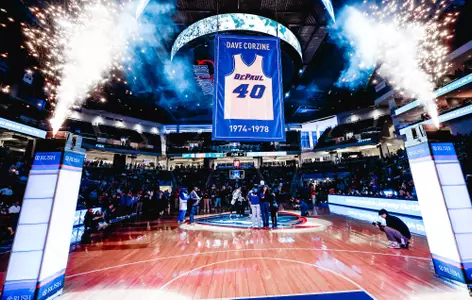 Dave Corzine sees his jersey retired into the rafters