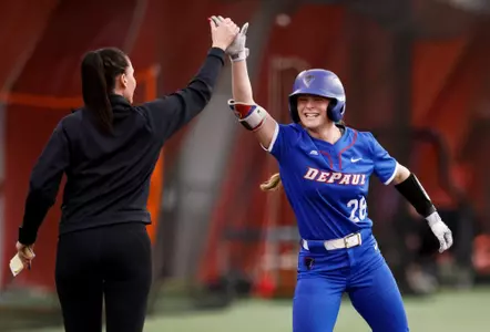 Addison Talbot high-fives head coach Liz Bouck-Jagielski