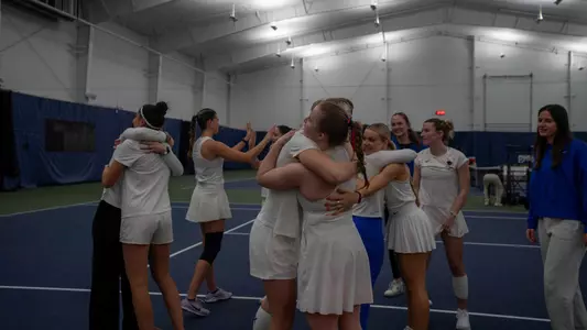 Team hugs during match