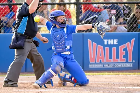 Zoe Levine throws ball from the plate
