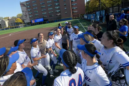 DePaul softball huddles