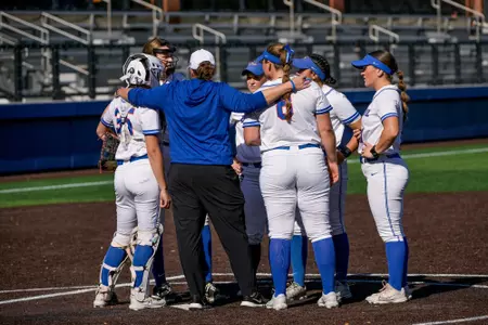 DePaul softball defense huddles in the circle