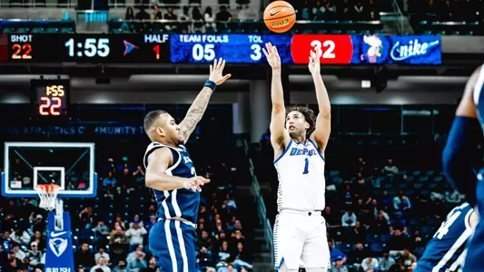 Isaiah Rivera sends off a three-point shot