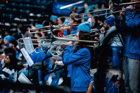 Screamin' Demons band performs at a basketball game