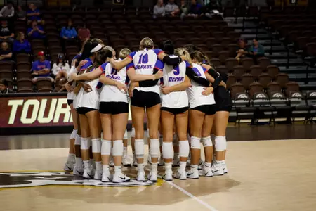 DePaul volleyball huddles on the court against Illinois State