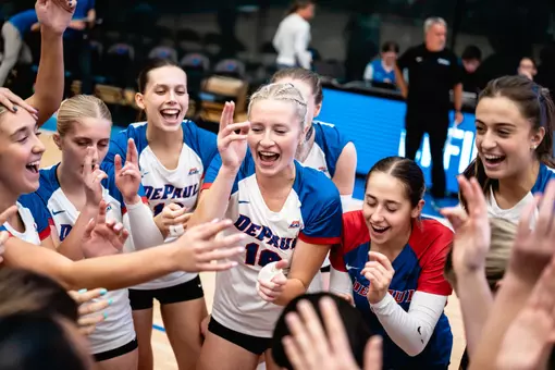 DePaul volleyball celebrates after a win