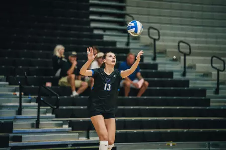 Martina Diana serves the volleyball