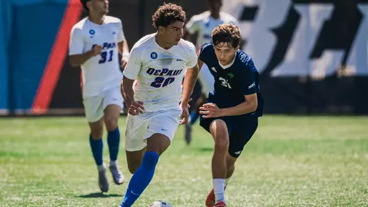 Keagan Pace dribbes the ball up the field