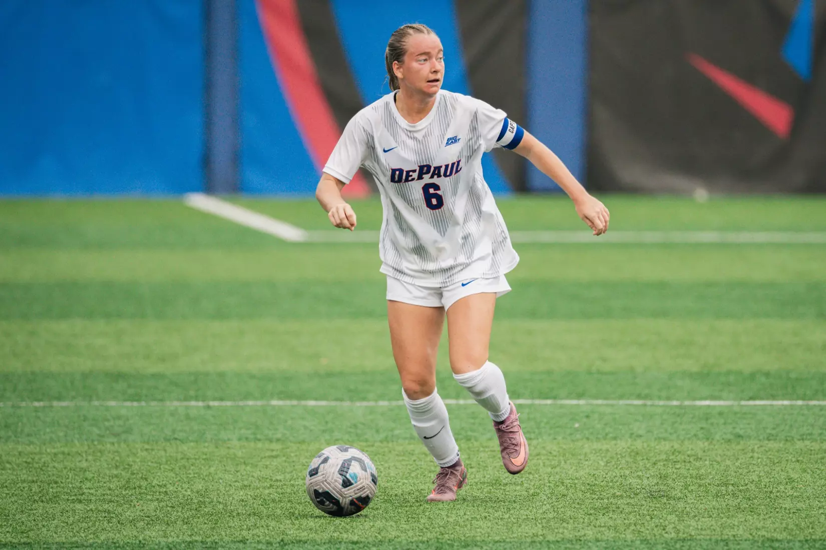 Defender Grace Menser looks to find an open teammate down the pitch.