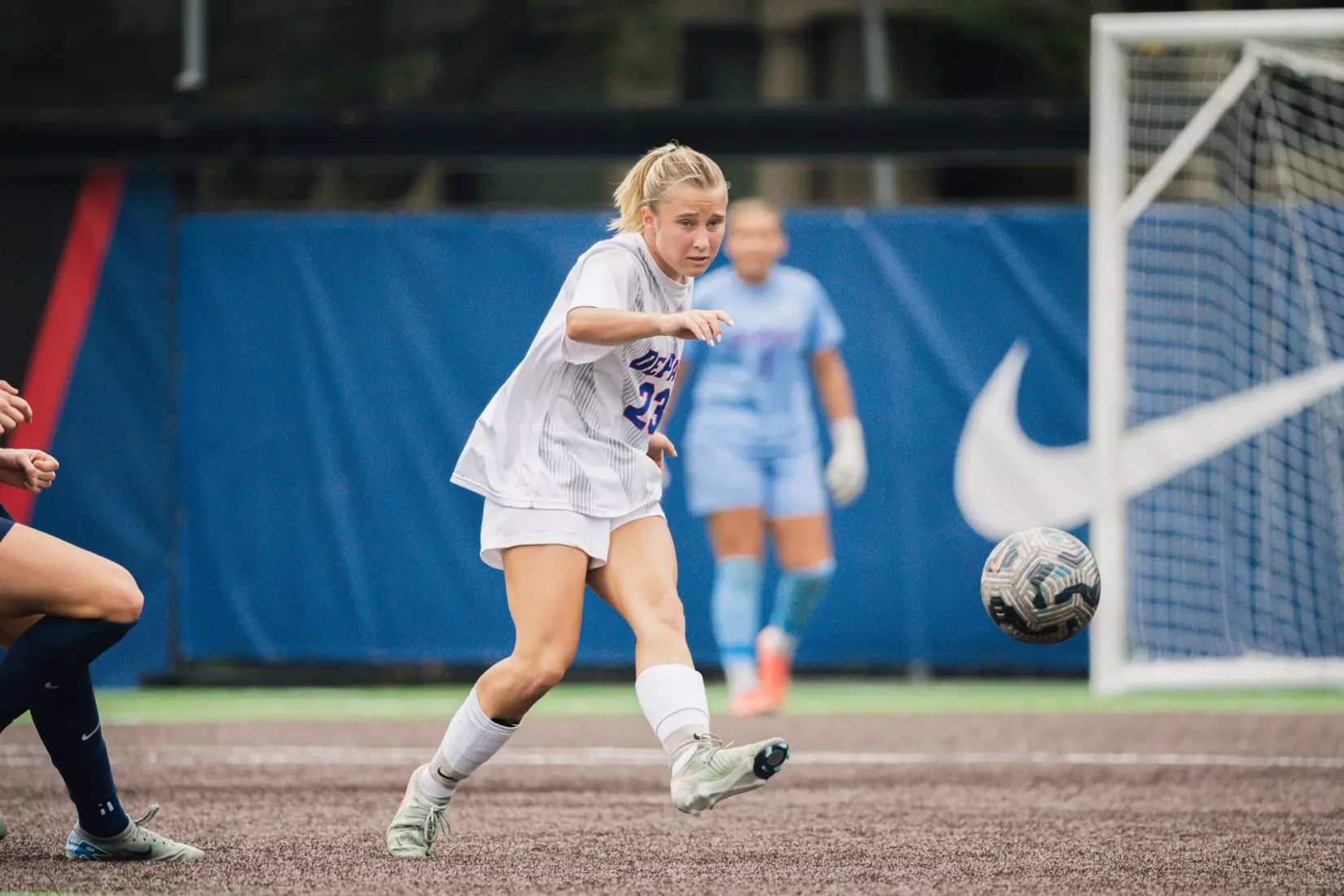 Freshman Sydnee Maxwell plays the ball to a fellow Blue Demon.