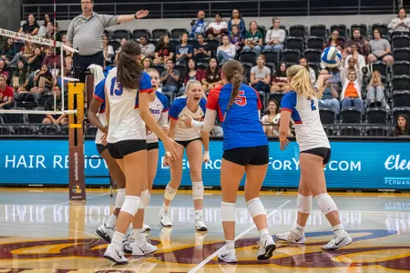 Morgan Stewart celebrates with her teammates after a big point