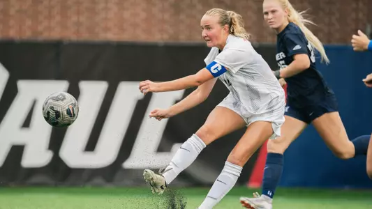 Danielle Fjeldsted kicks the ball