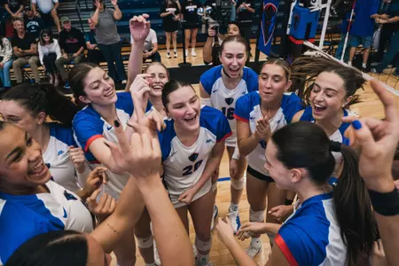 DePaul Volleyball Celebrates after defeating UConn