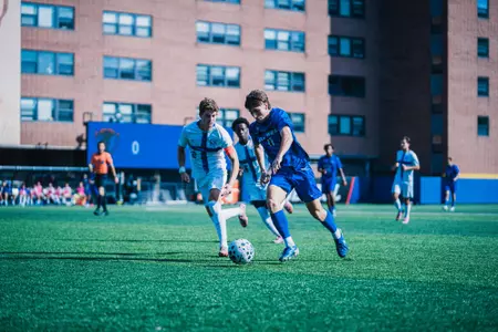 Daniel Hickiewicz dribbles down field