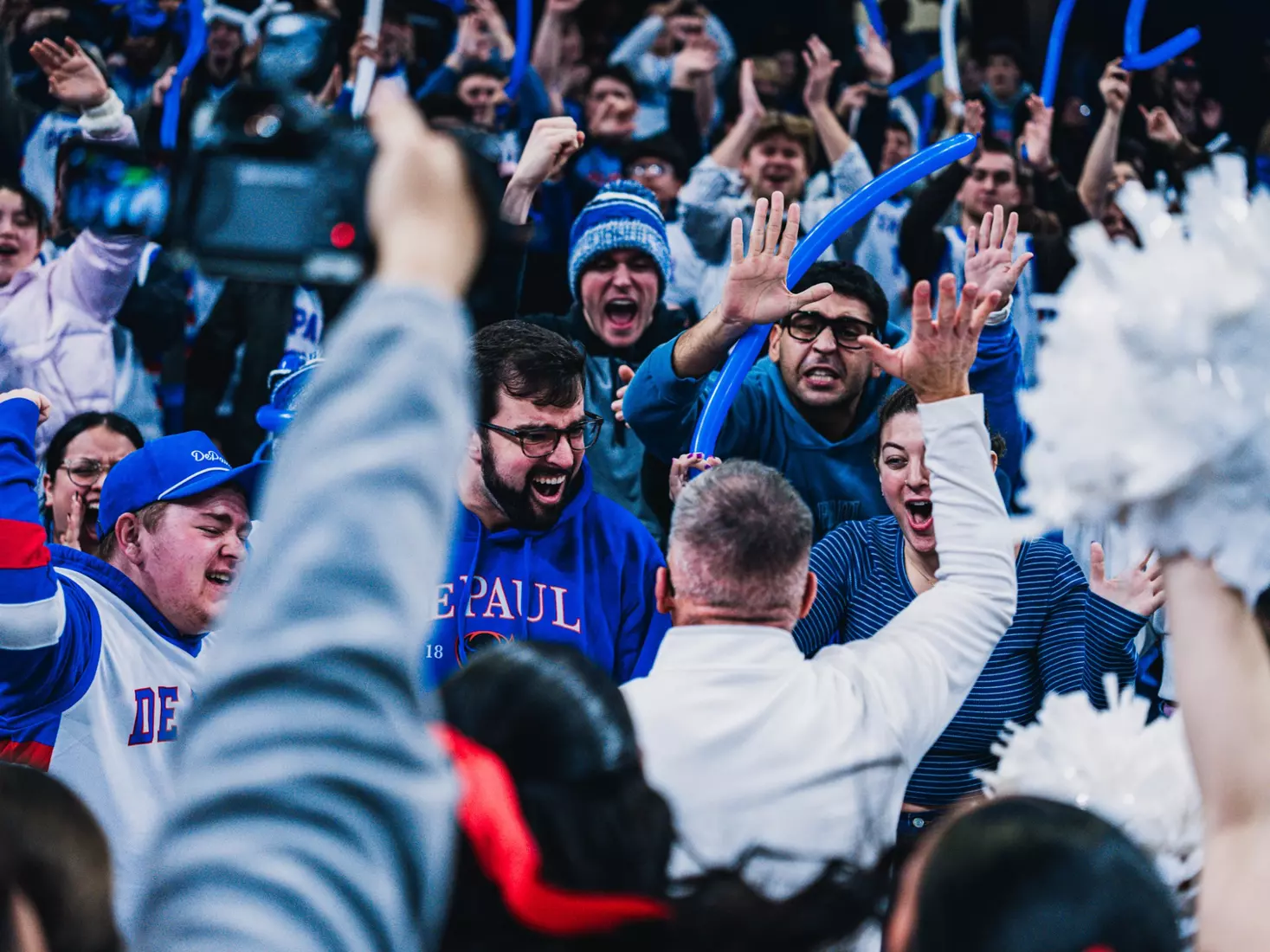Coach Holtmann celebrating with the student section after the game.