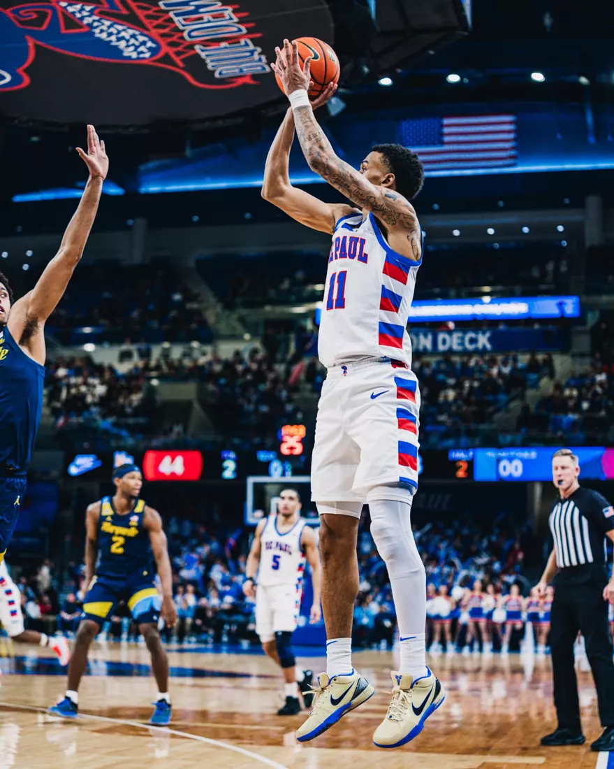 CJ Gunn shooting a 3-point jumper.