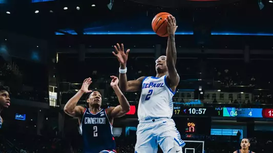 Guard Layden Blocker attempts a layup against UConn.