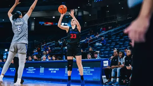 Guard Kate Novik takes aim from three.