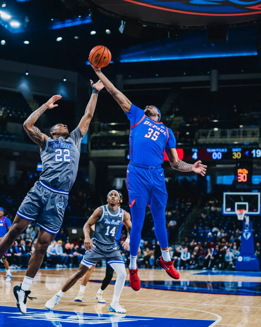 NJ Benson contests for a rebound.