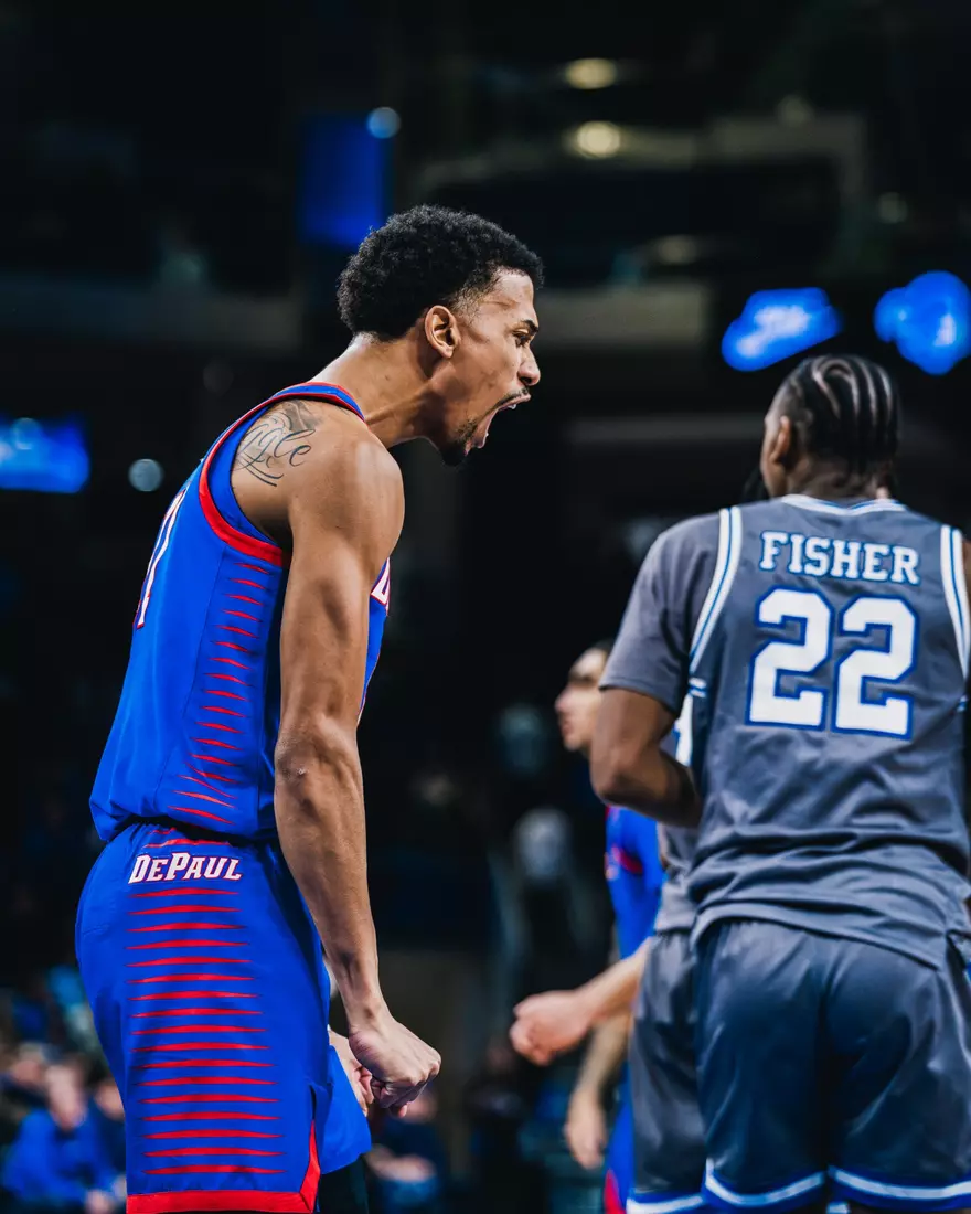 CJ Gunn flexes in celebration.