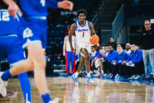 Forward Kaleb Banks takes the ball down the court.