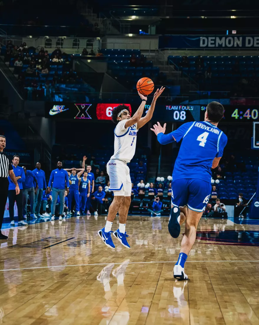 RJ Smith sprays an attempt from long range in the second half.