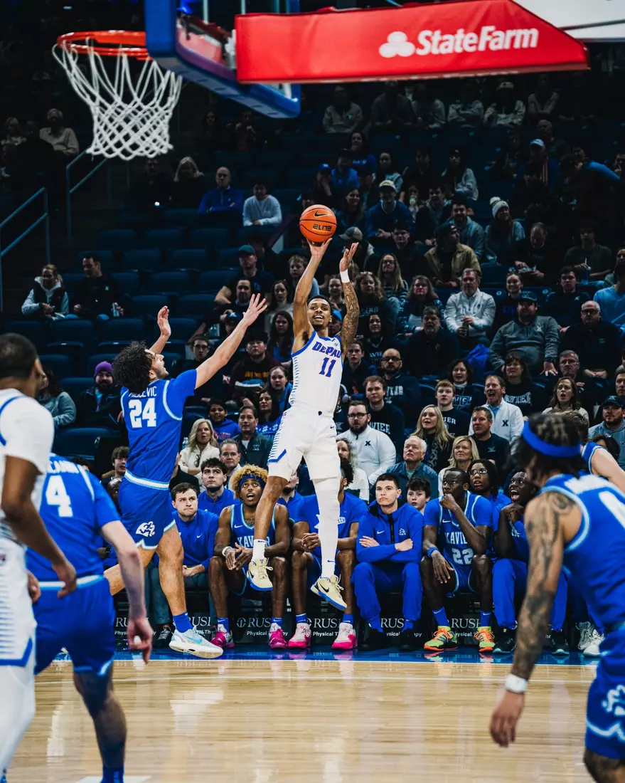 Senior CJ Gunn fades away for the three.