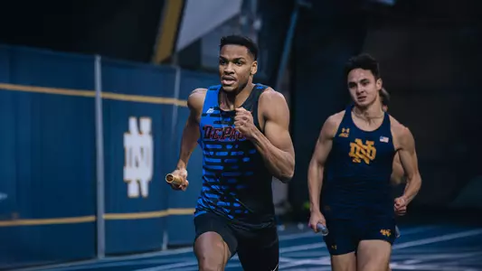 Daniel Fasasi running a relay