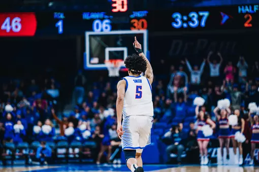 RJ Smith celebrates a three pointer.